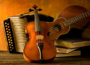 Violin, guitar, accordion, mandolin with music books